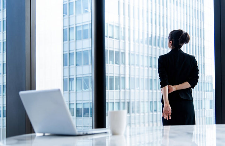 Woman looking out an office window