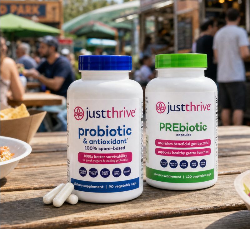 Just Thrive Probiotic and PREbiotic bottles side by side on a cafe table