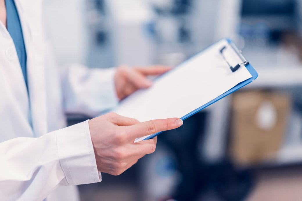 Clinician holding a clipboard
