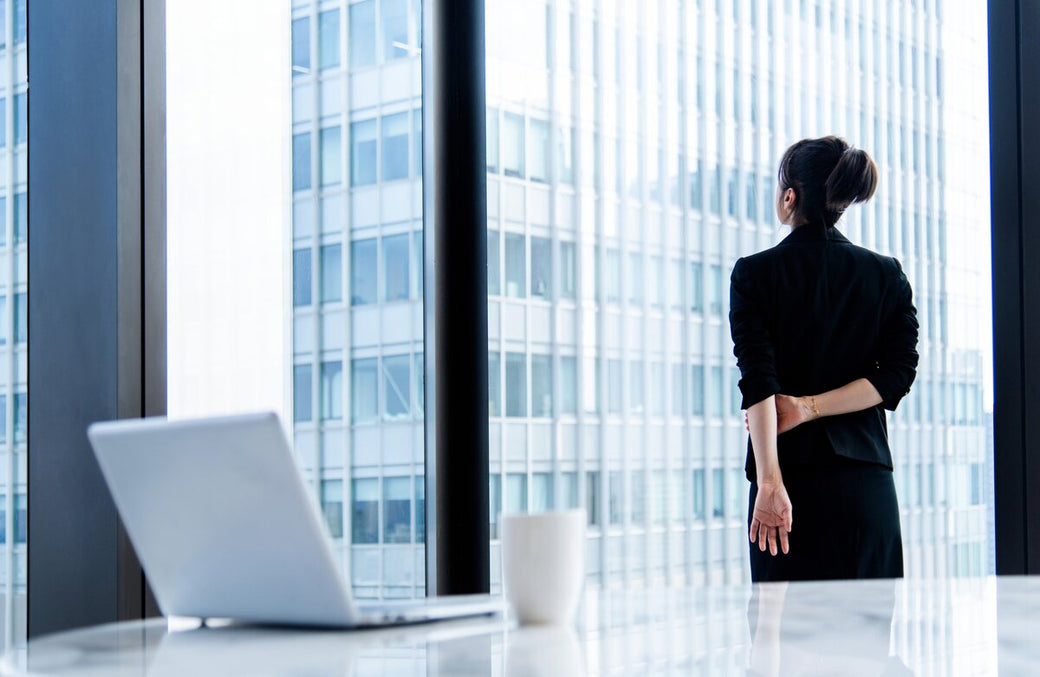 Woman looking out an office window